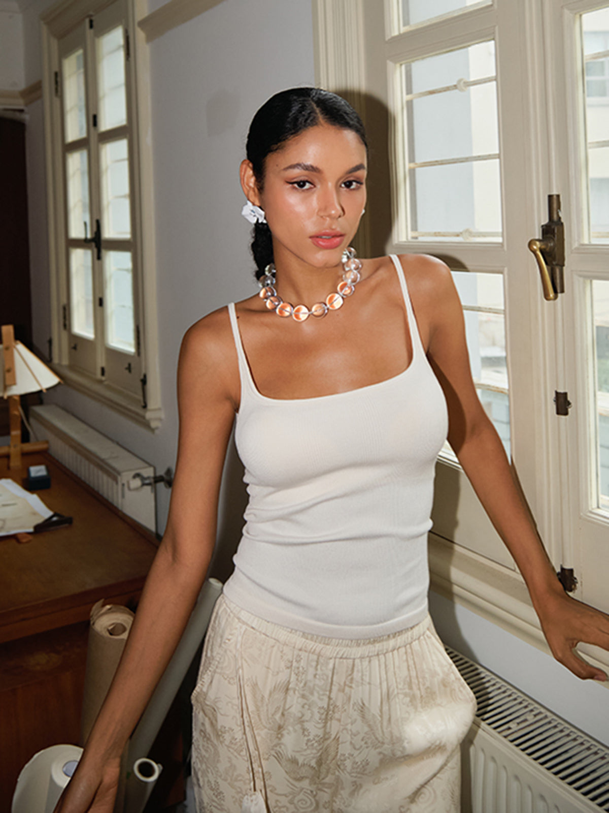 Sleeveless top for women with low neckline